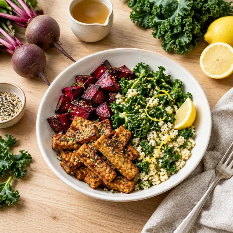 Crispy Tempeh Bowl with Roasted Beets, Maple-Lemon Kale & Couscous, plated