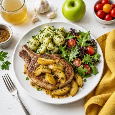Pork Chop with Honey-Dijon Apples, Parsley Potatoes & Mixed Greens